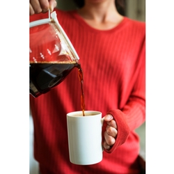 woman pouring coffee made with great-tasting Culligan Water